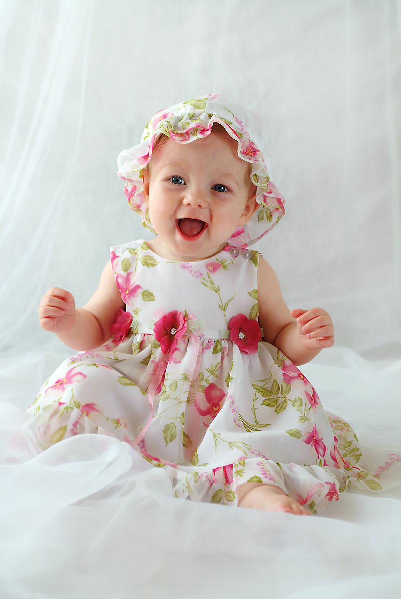 happy baby girl in a sundress