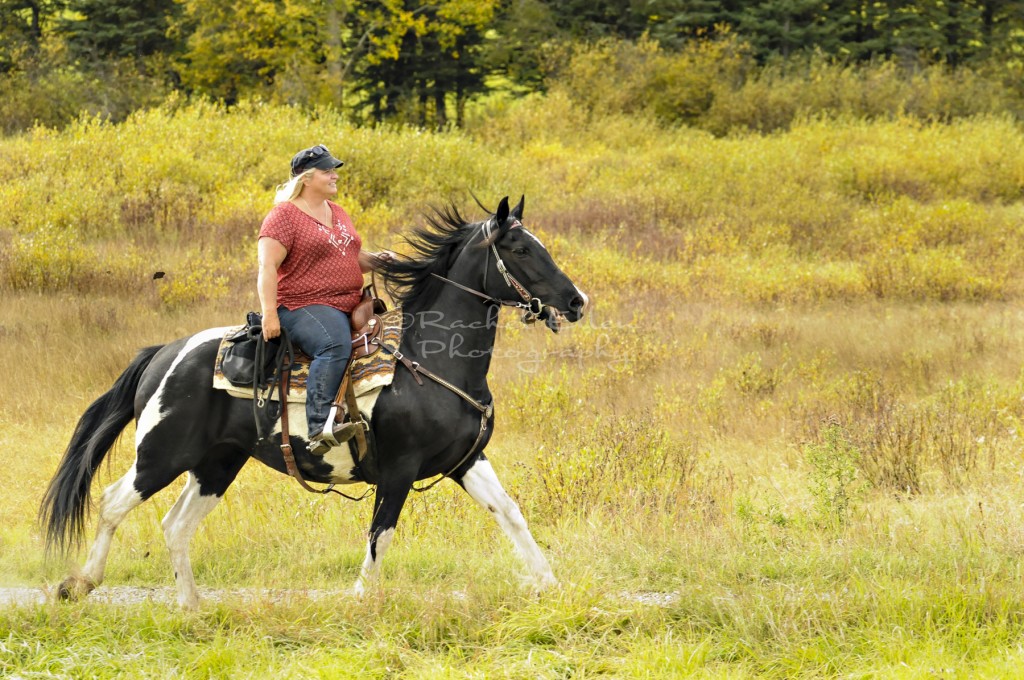 cowgirl riding in the foothills